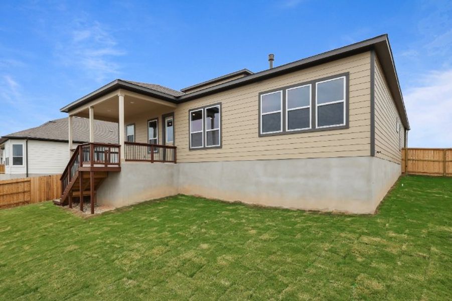 A house with a grass yard. A house with a grass yard.