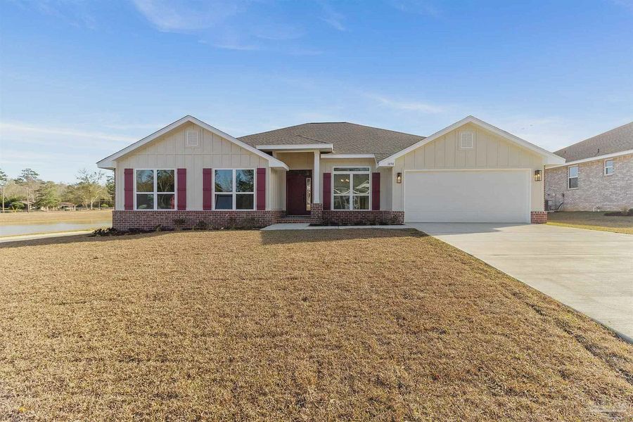 Front exterior of a new home in Pecan Valley, Cantonment, FL, highlighting curb appeal (Image 1). Front exterior of a new home in Pecan Valley, Cantonment, FL, highlighting curb appeal (Image 1).