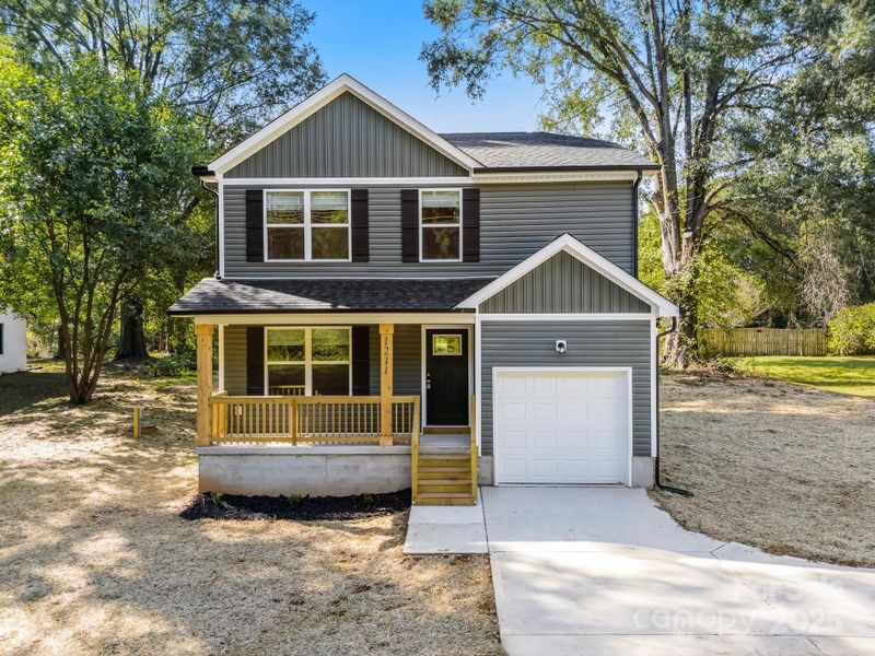 Front exterior of a new home in , Mooresville, NC, highlighting curb appeal (Image 1).