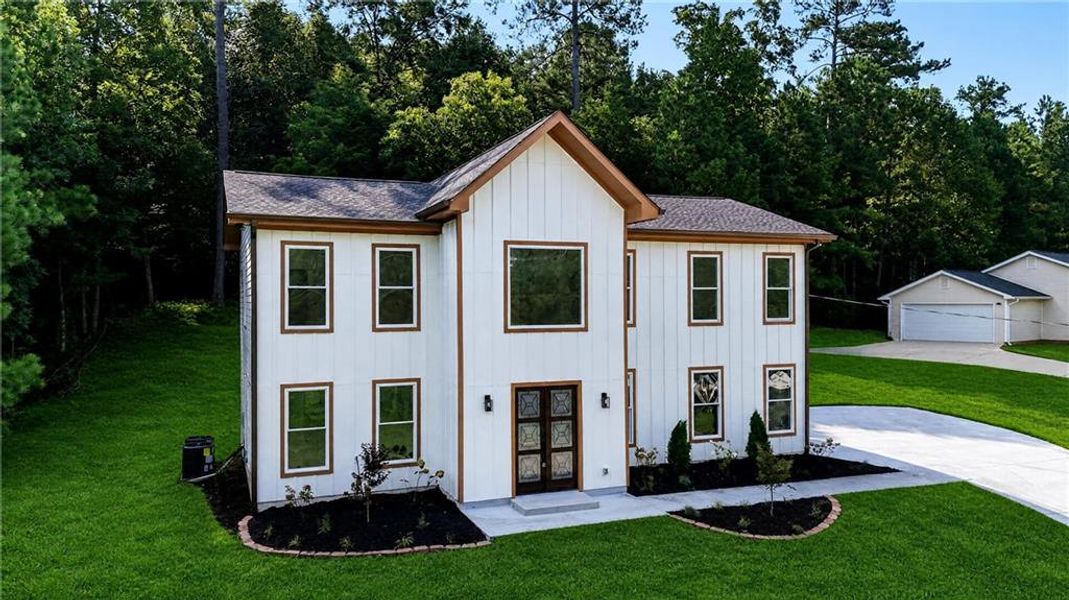 Front exterior of a new home in , Palmetto, GA, highlighting curb appeal (Image 21). Front exterior of a new home in , Palmetto, GA, highlighting curb appeal (Image 21).