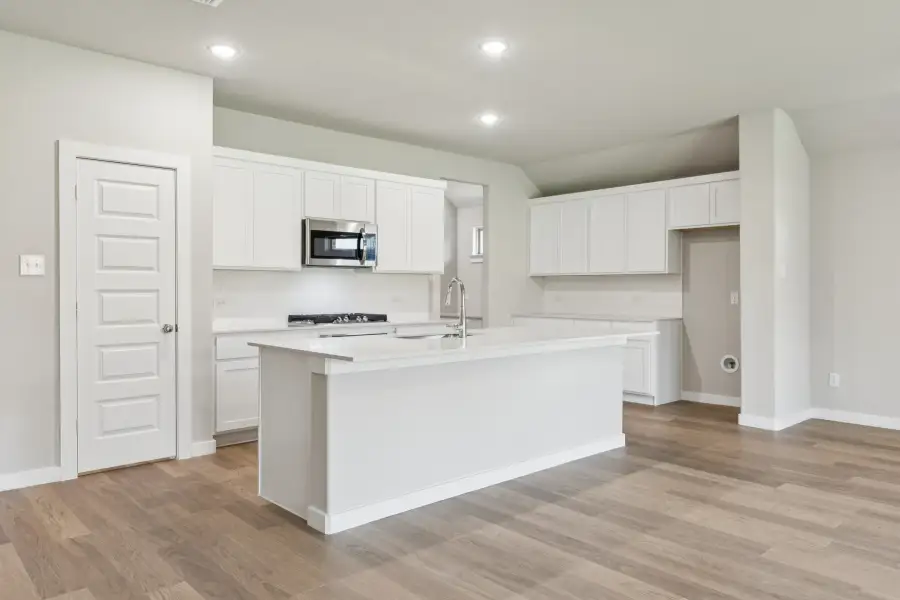 Kitchen in the Heisman home plan by Trophy Signature Homes – REPRESENTATIVE PHOTO