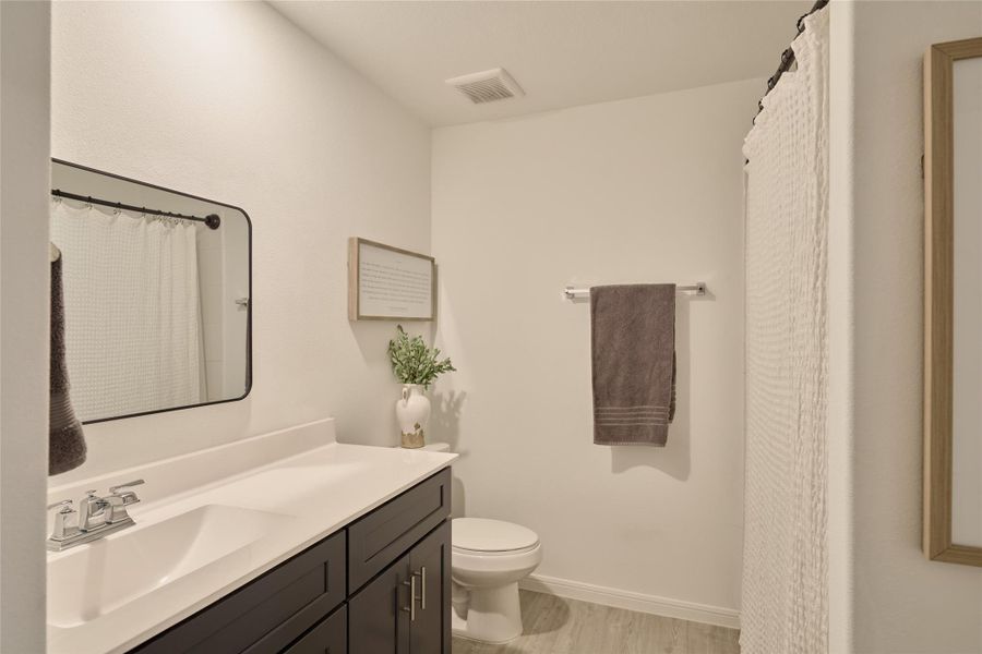 Furnished interior view inside a new home in The Pines At Seven Coves, Willis (Image 38).