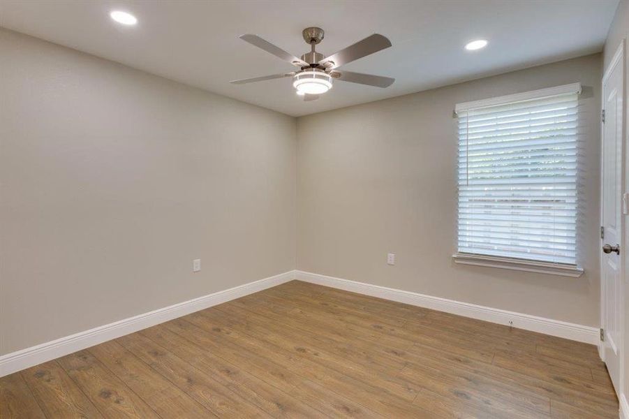 Unfurnished room with light wood-style flooring, recessed lighting, and a ceiling fan