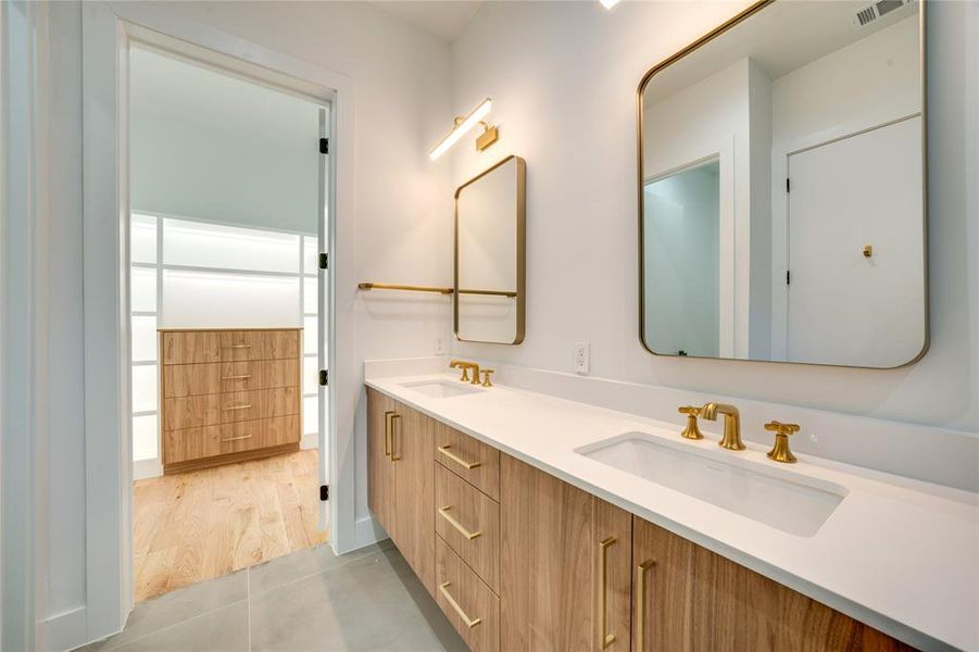 Bathroom featuring vanity and hardwood / wood-style floors