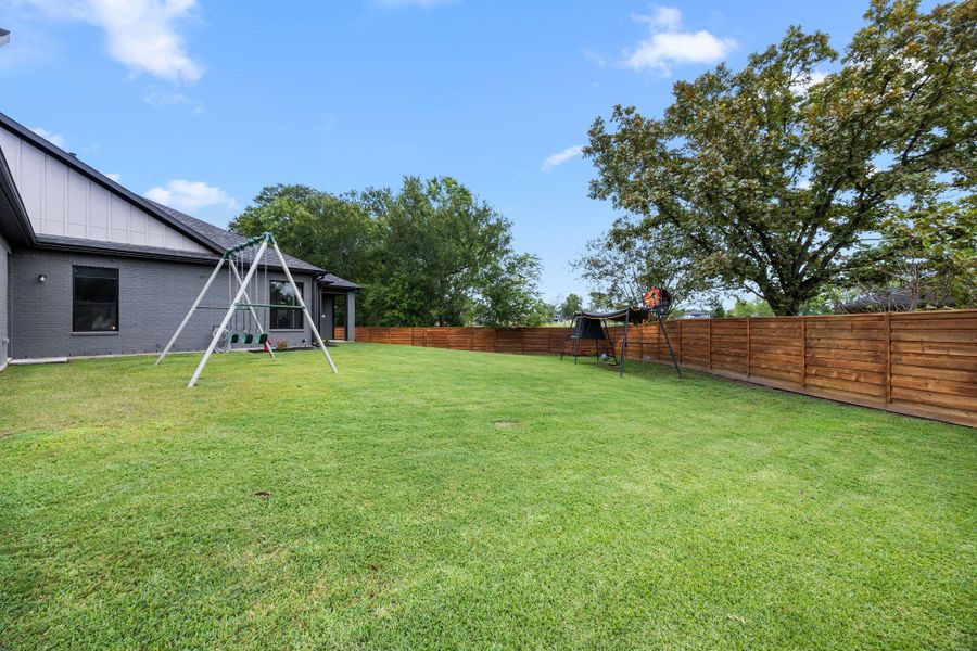 Another view of the back yard that is already pre-set for a pool to be built. Another view of the back yard that is already pre-set for a pool to be built.