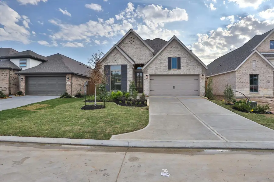 Front exterior of a new home in The Highlands 45', Porter, TX, highlighting curb appeal (Image 2).