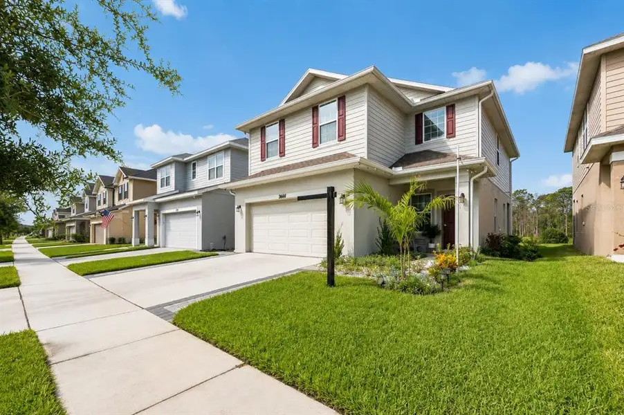 Front exterior of a new home in , Harmony, FL, highlighting curb appeal (Image 2). Front exterior of a new home in , Harmony, FL, highlighting curb appeal (Image 2).