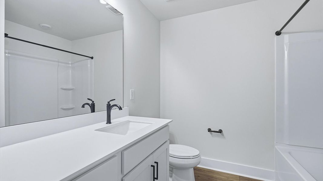 Top-notch bathroom with current fixtures, tasteful materials, and elevated charm near Downtown Fountain Inn