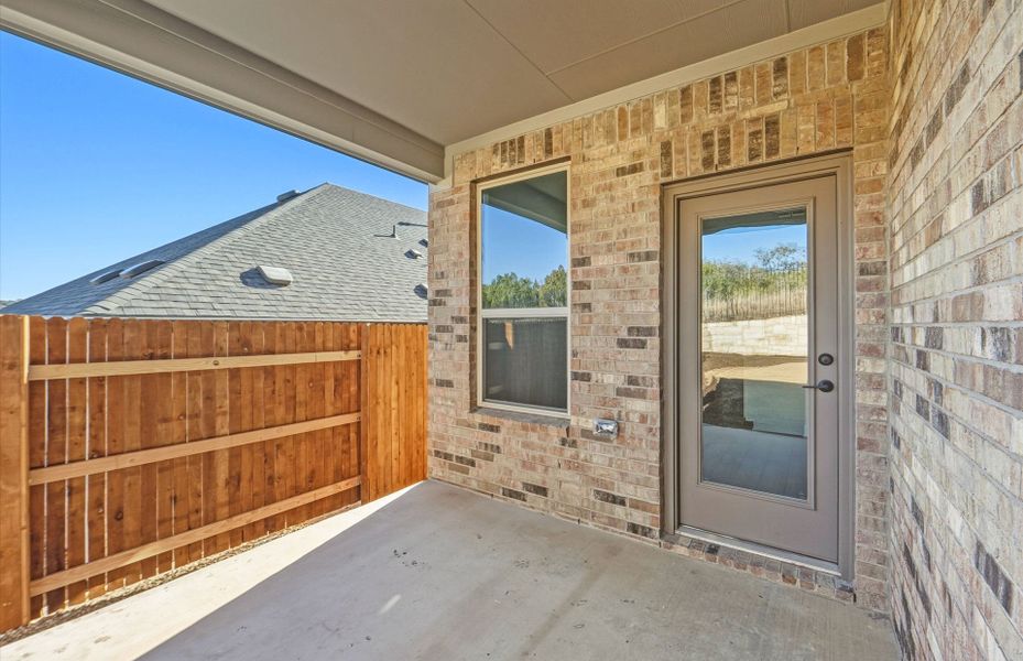 Exterior details and patio area of a home in West Cypress Hills, Spicewood (Image 25).