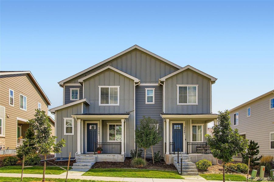 Front exterior of a new home in Haskins Station, Arvada, CO, highlighting curb appeal (Image 23).