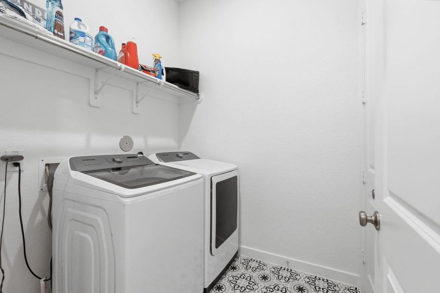 Efficient in-house laundry room for added convenience.