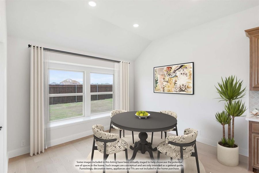 Dining area with round dark table, patterned chairs, vaulted ceiling, and large window with backyard view Dining area with round dark table, patterned chairs, vaulted ceiling, and large window with backyard view