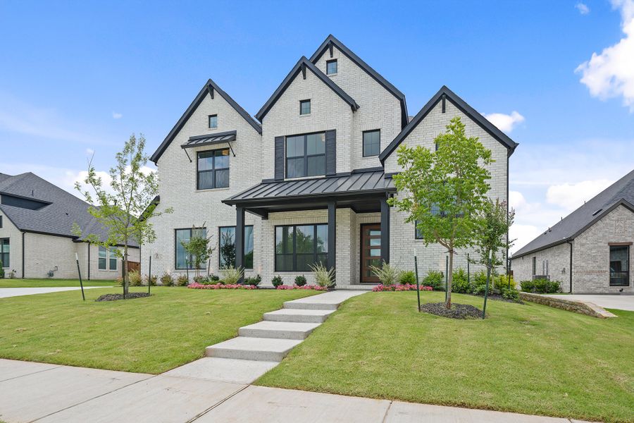 Front exterior of a new home in Winding Creek, Rockwall, TX, highlighting curb appeal (Image 27). Front exterior of a new home in Winding Creek, Rockwall, TX, highlighting curb appeal (Image 27).