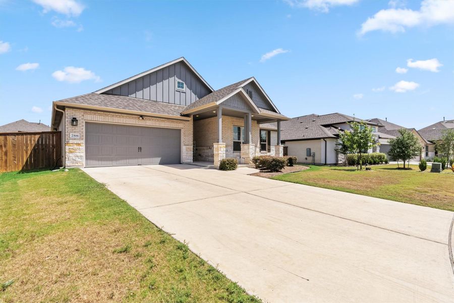 Craftsman house with board and batten siding, driveway, a garage, covered porch, and a shingled roof Craftsman house with board and batten siding, driveway, a garage, covered porch, and a shingled roof