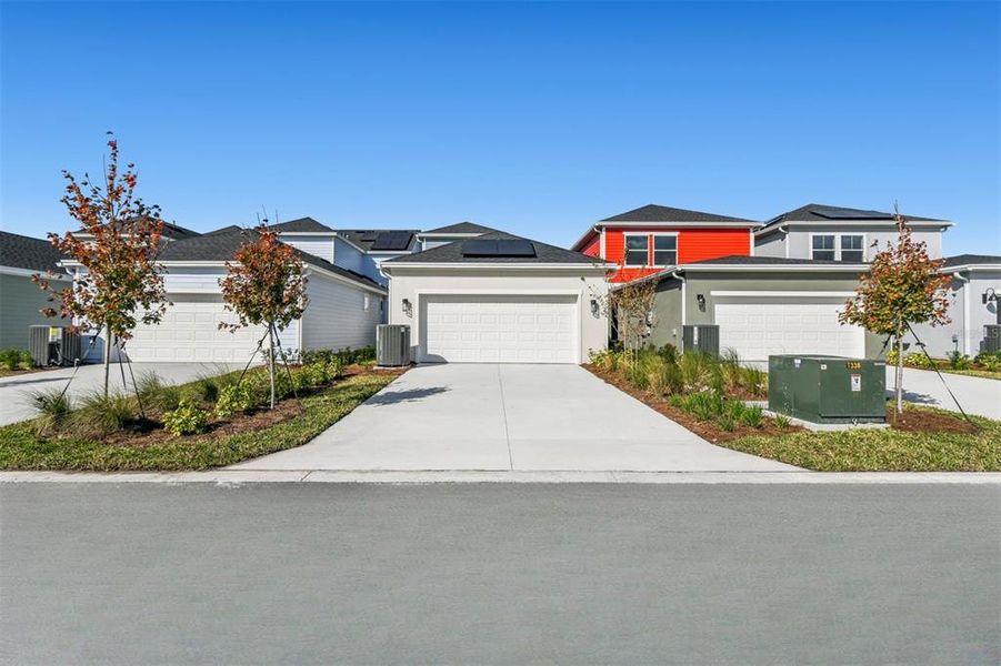 Front exterior of a new home in Laureate Park at Lake Nona - Garden Series, Orlando, FL, highlighting curb appeal (Image 22).