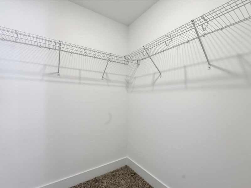 Spacious, unfurnished interior of a new home in The Coves at Lakes of Cane Bay, Summerville (Image 24).