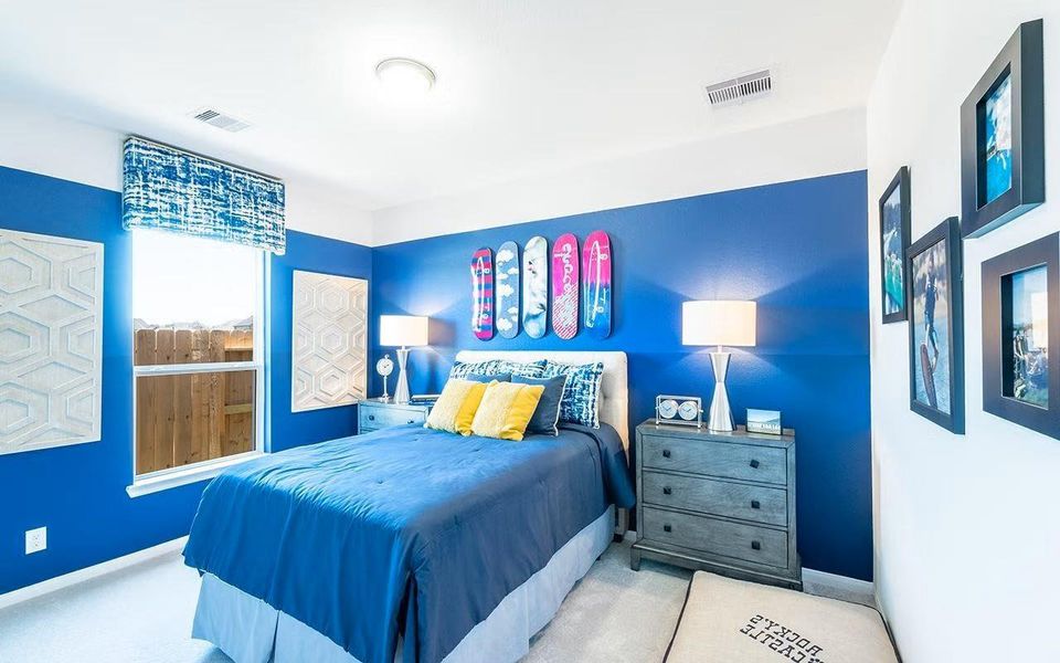 Another spacious secondary bedroom featuring a charming accent wall, comfortable layout, and cozy appeal, perfect for creating a personal retreat or stylish guest room. **Photos are representative only and may vary as built.**