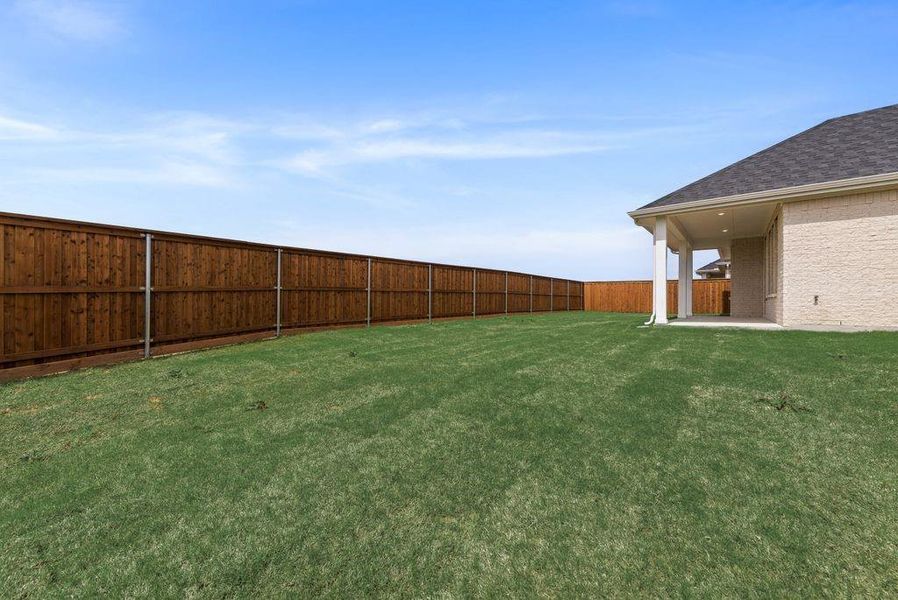 Exterior details and patio area of a home in Spiritas Ranch, Little Elm (Image 4).