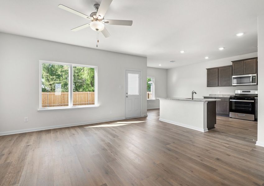 The living room sits adjacent to the kitchen. The living room sits adjacent to the kitchen.