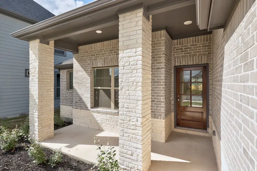 Exterior details and patio area of a home in Prairie Winds, Hutto (Image 3).