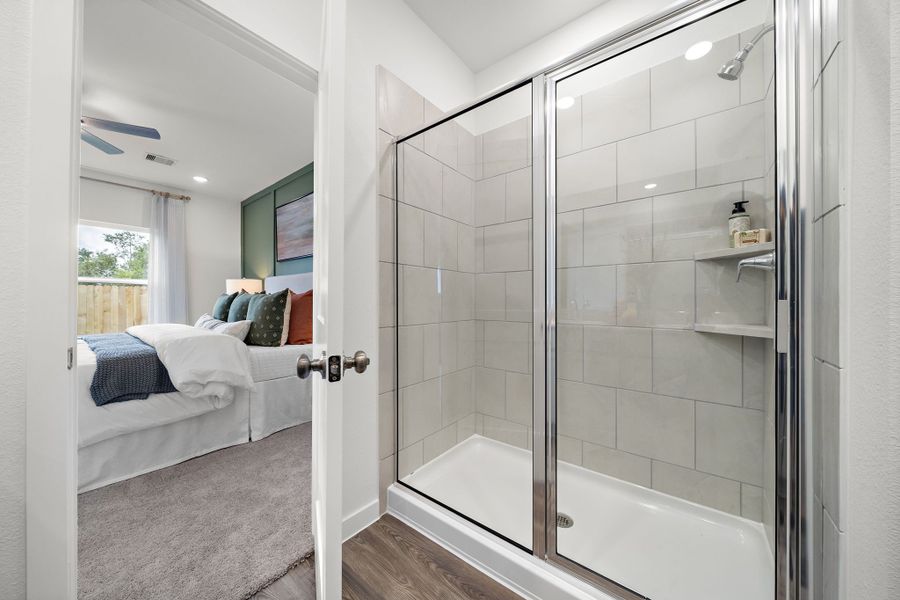 A bathroom with a glass shower. A bathroom with a glass shower.