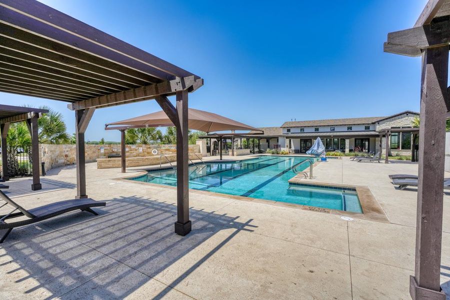 Community pool with a patio area and a pergola