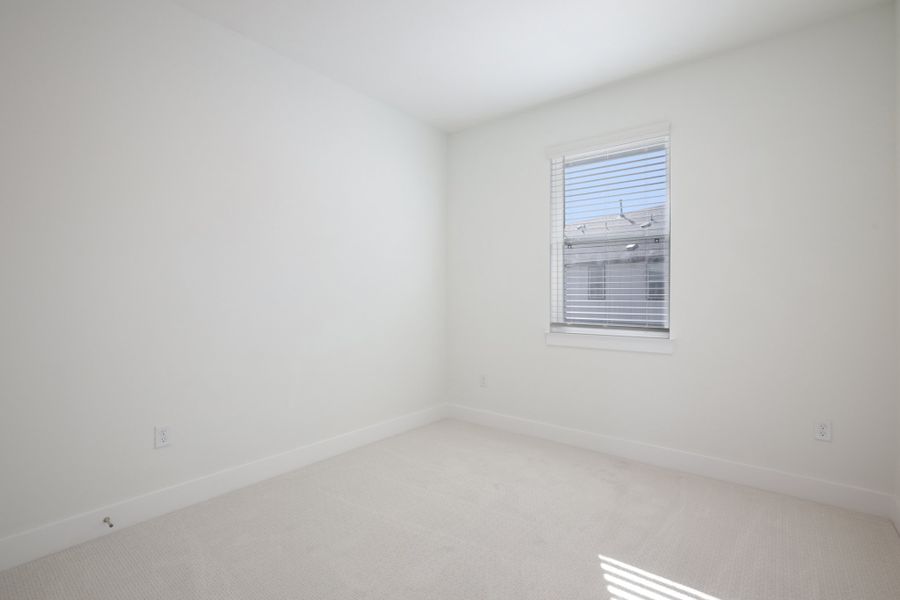 Spacious, unfurnished interior of a new home in Koenig Townhomes, Austin (Image 23).