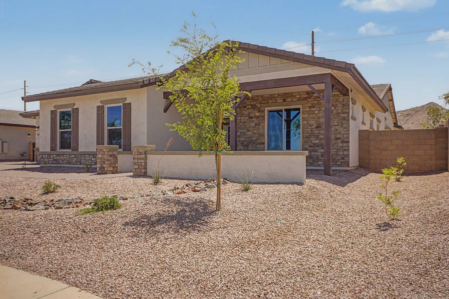 Front exterior of a new home in Bellero Estates, Queen Creek, AZ, highlighting curb appeal (Image 2). Front exterior of a new home in Bellero Estates, Queen Creek, AZ, highlighting curb appeal (Image 2).