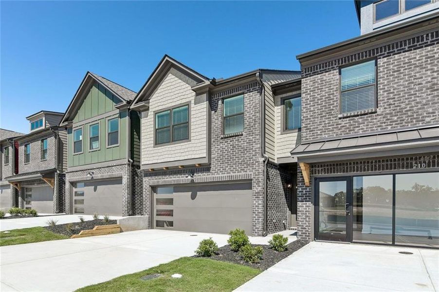 Front exterior of a new home in Tribute, Hoschton, GA, highlighting curb appeal (Image 2). Front exterior of a new home in Tribute, Hoschton, GA, highlighting curb appeal (Image 2).
