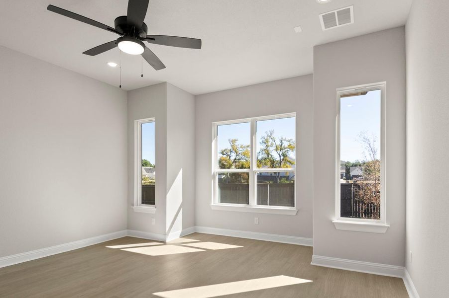 Spare room with recessed lighting, wood finished floors, and a ceiling fan Spare room with recessed lighting, wood finished floors, and a ceiling fan