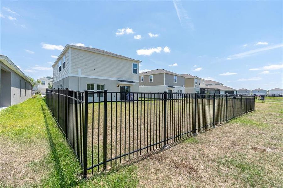 Front exterior of a new home in Crosswind Point, Parrish, FL, highlighting curb appeal (Image 21).