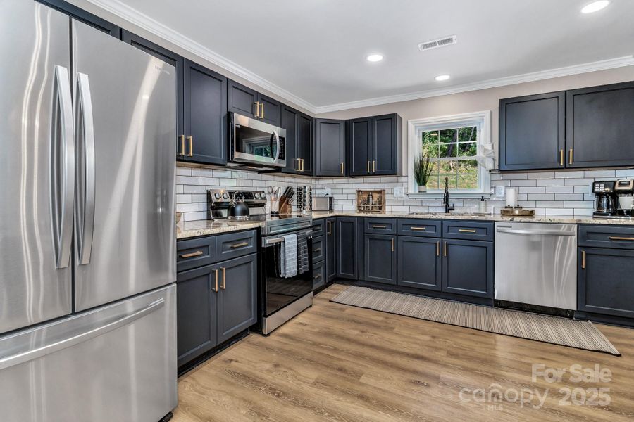 Furnished interior view inside a new home in , Waynesville (Image 9).