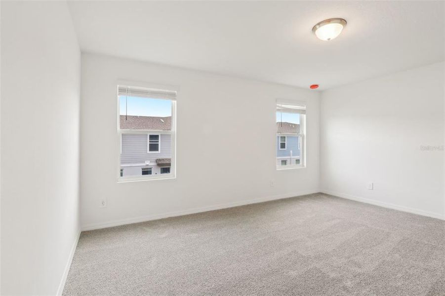 Spacious, unfurnished interior of a new home in The Meadow at Crossprairie Townes, St. Cloud (Image 25).