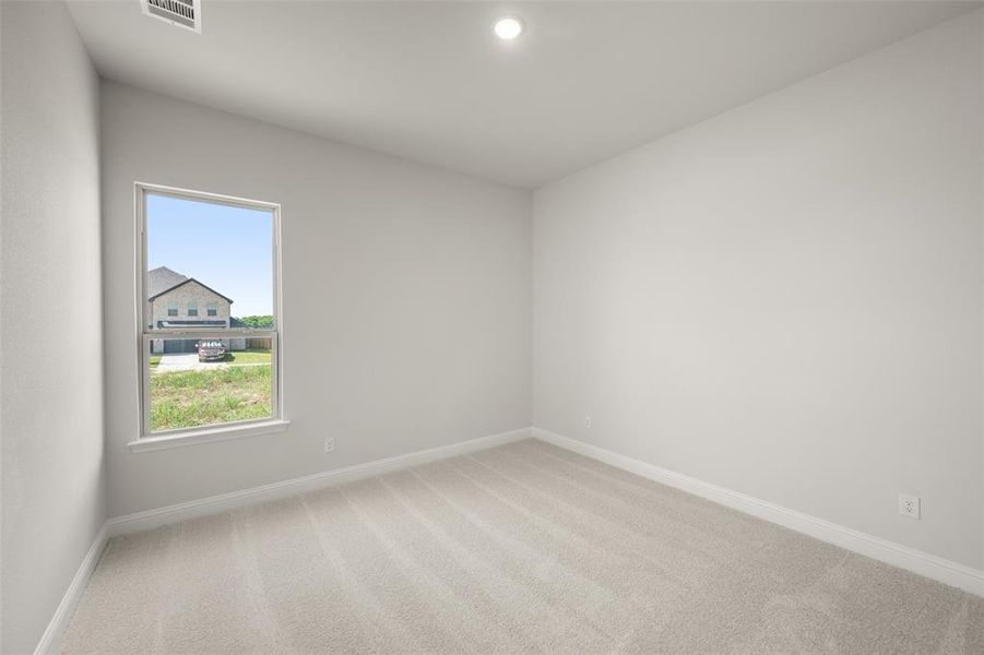 Carpeted spare room with baseboards and recessed lighting Carpeted spare room with baseboards and recessed lighting