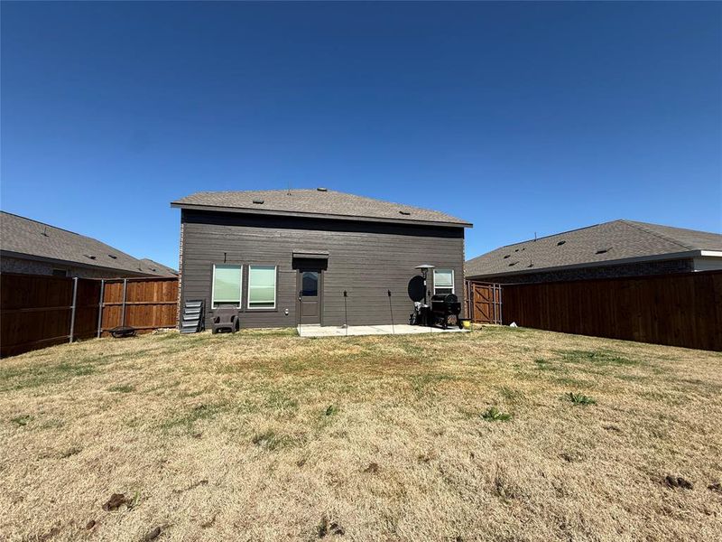 Exterior details and patio area of a home in Mobberly Farms, Pilot Point (Image 4).