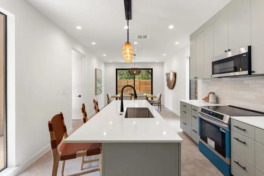 Thoughtful architectural planning makes the kitchen both functional and inviting. Thoughtful architectural planning makes the kitchen both functional and inviting.