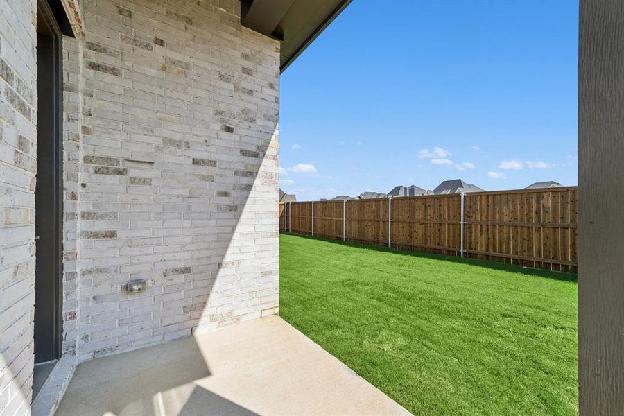 Exterior details and patio area of a home in Sandbrock Ranch, Aubrey (Image 3). Exterior details and patio area of a home in Sandbrock Ranch, Aubrey (Image 3).