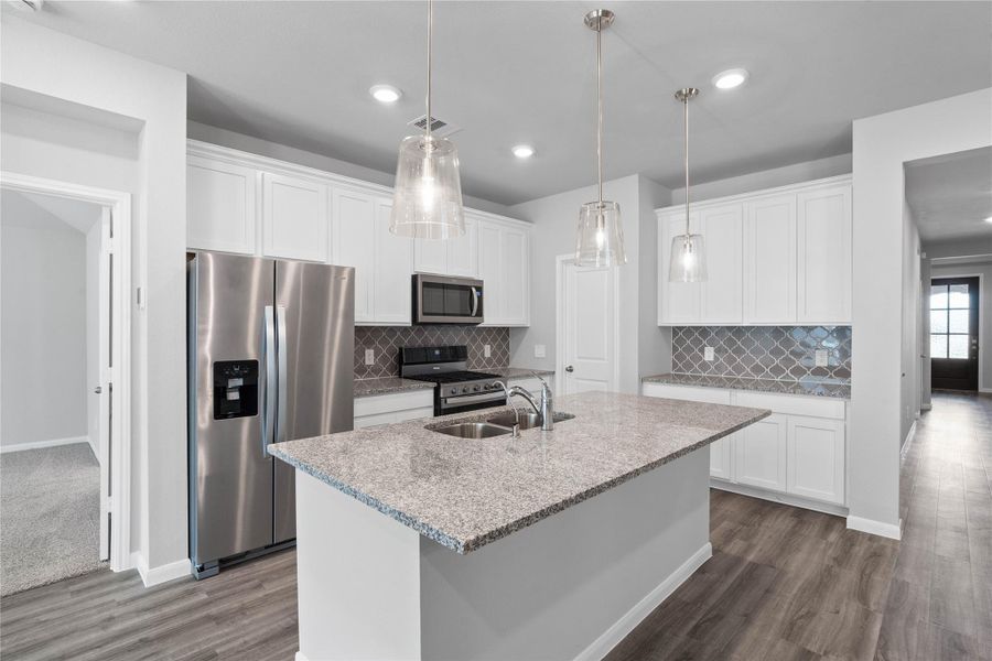 The kitchen island provides a convenient breakfast bar, perfect for casual dining and or long conversations. The kitchen island provides a convenient breakfast bar, perfect for casual dining and or long conversations.