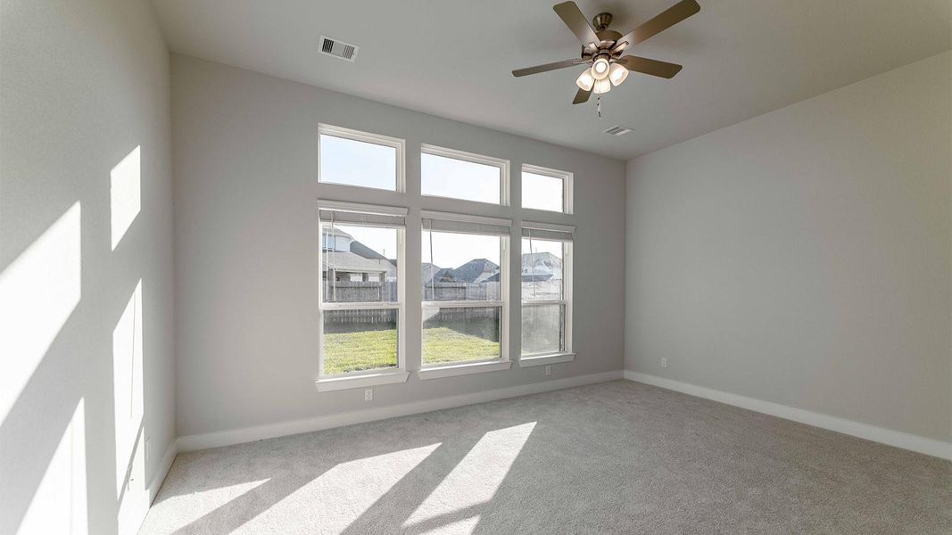 Spacious, unfurnished interior of a new home in Sunterra, Katy (Image 9).