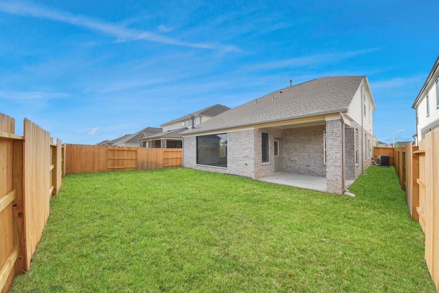 Explore the expansive backyard with its inviting covered patio—a perfect blend of space for the kids to play and adults to unwind. Ideal for creating your outdoor oasis, this backyard accommodates patio furniture, a BBQ pit, and endless possibilities for leisure and entertainment.