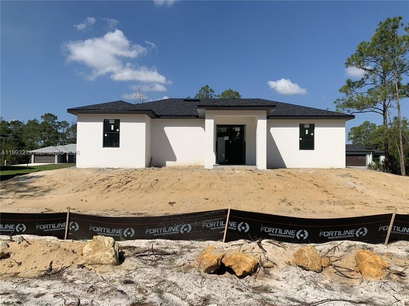 In-progress construction of a new home in , Lehigh Acres, FL (Image 6).