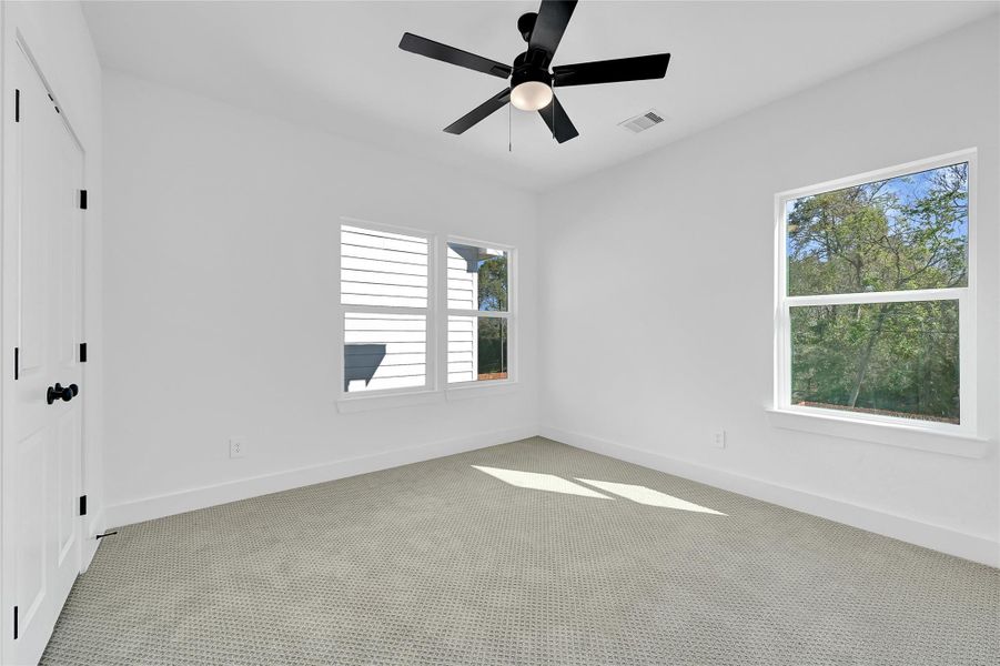 Versatile third bedroom perfect for guests or a home office.