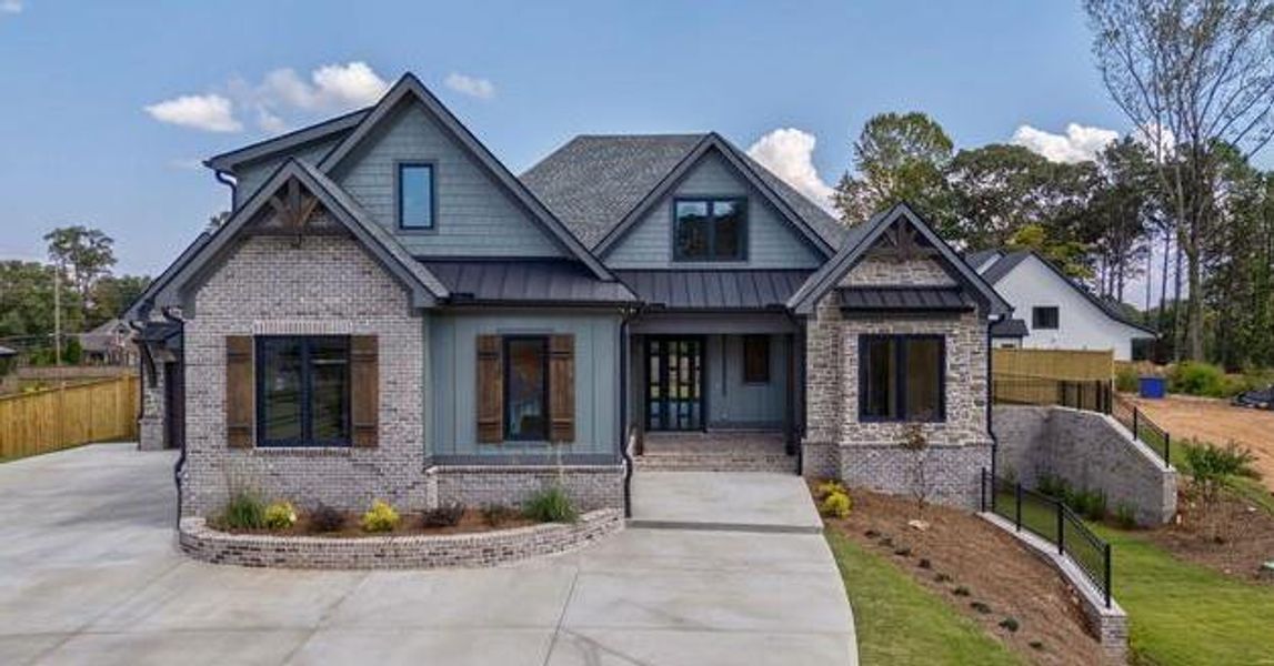 Front exterior of a new home in , Cumming, GA, highlighting curb appeal (Image 23).