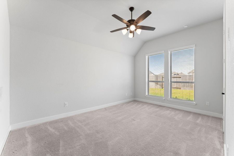One of several secondary bedrooms complete with ceiling fans and plush carpet. One of several secondary bedrooms complete with ceiling fans and plush carpet.