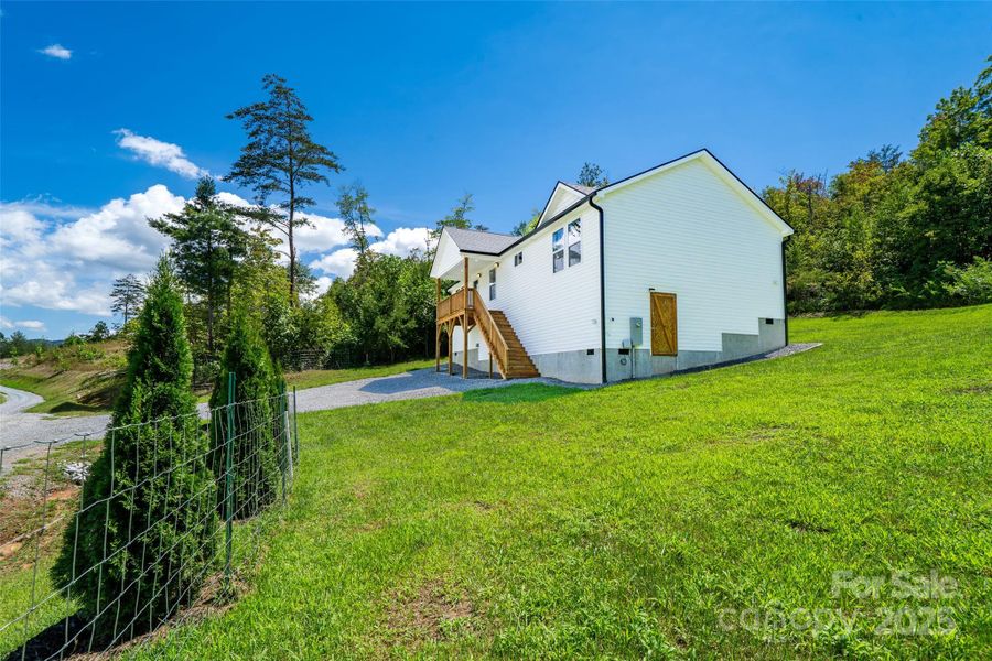Front exterior of a new home in , Old Fort, NC, highlighting curb appeal (Image 15).