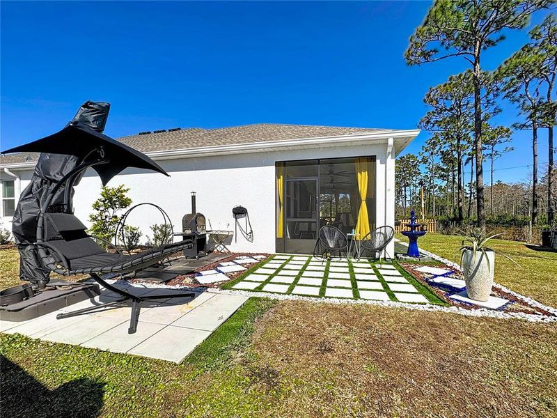 Exterior details and patio area of a home in Bridgewalk, St. Cloud (Image 25).