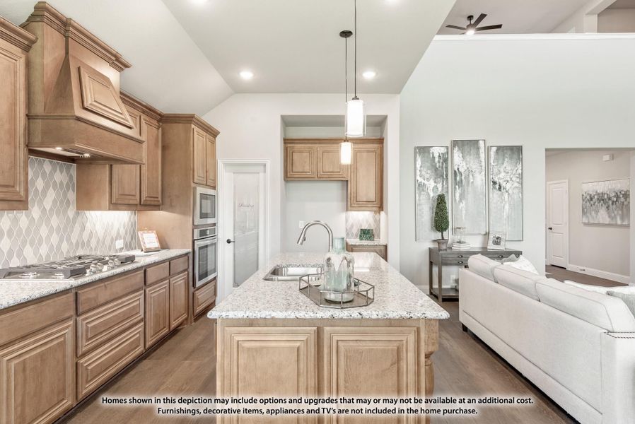 Open kitchen with wood cabinets, granite island, and gas cooktop, open to living room with high ceilings Open kitchen with wood cabinets, granite island, and gas cooktop, open to living room with high ceilings