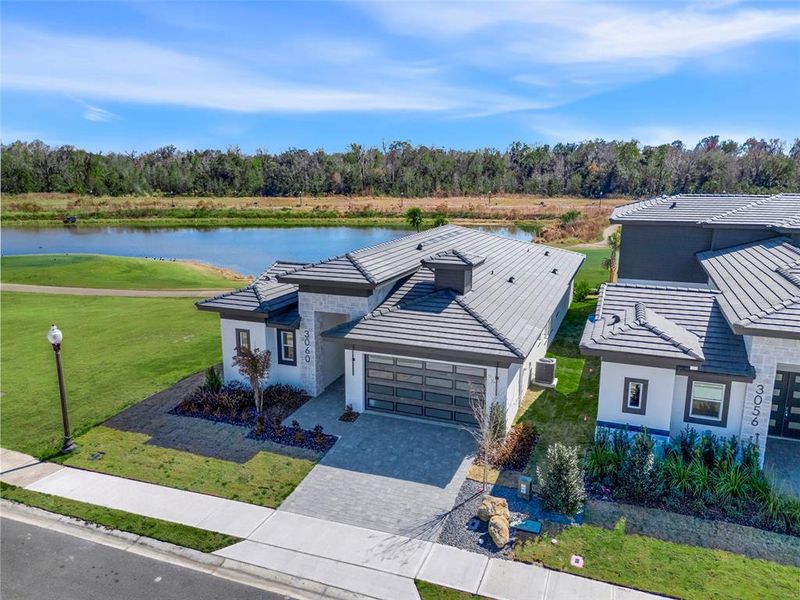 Front exterior of a new home in Hampton Green at Providence, Davenport, FL, highlighting curb appeal (Image 22).