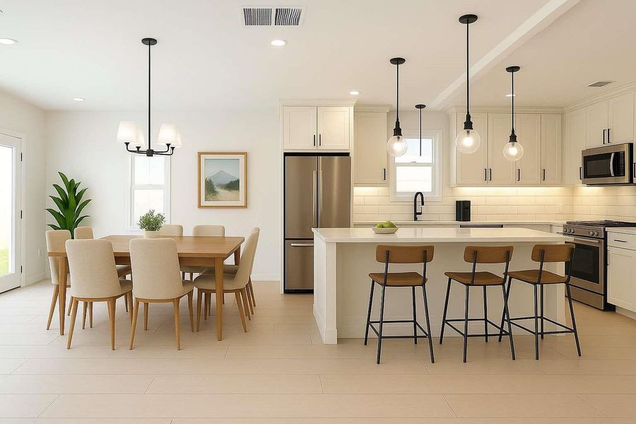 Experience the elegance of a beautifully staged kitchen and dining area with a view of the inviting covered patio.