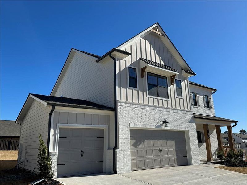 Front exterior of a new home in Summerlin, Winder, GA, highlighting curb appeal (Image 10). Front exterior of a new home in Summerlin, Winder, GA, highlighting curb appeal (Image 10).